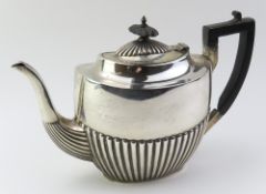 A Victorian silver teapot with squared