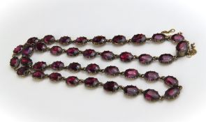 A 19th century gold garnet necklace, the forty-one ova