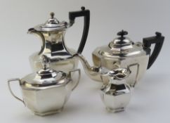 A silver tea set, comprising a teapot