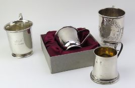 Four silver mugs of different sizes and designs