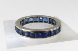 An unmarked white metal sapphire full eternity rin