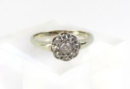 An unmarked white gold old cut diamond daisy cluster style