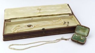 An unmarked three row pearl bracelet with a tongue