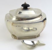 A silver lidded tea caddy along with a Georgian silver