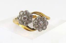 An Edwardian ‘Toi et Moi’ daisy cluster ring, of t