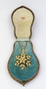 A late 19th or early 20th century gold pearl brooch pendant