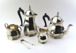 A silver tea set comprising a teapot, water jug,