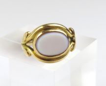 A signet ring set with an oval sardonyx in a rub o