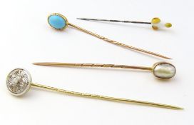 A diamond set stock or tie pin, the central round