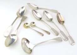 A small collection of silver flatware, including t
