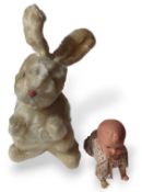A mid-20th century wind up rabbit, the head moves