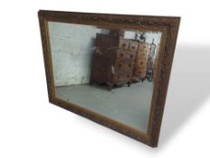 A large rectangular mantle mirror with gilted fram