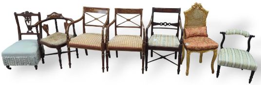 A collection of seven chairs, two being a pair. In