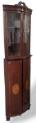 A mahogany corner cabinet of two tiers with marque