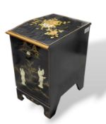 A small ebonised oriental cabinet with bow front and bracke