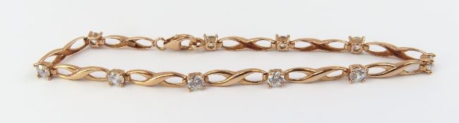 A rose gold bracelet, marked ‘375 CZ’, set with te