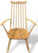 A wooden Ercol rocking chair, with smooth