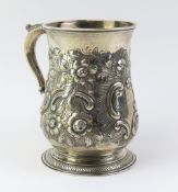 A Georgian silver tankard of gourd shape, later em