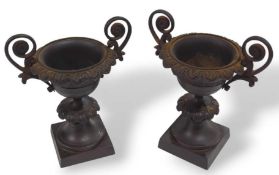 A pair of Grand Tour style bronzed garnitures in t