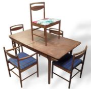 A wooden extendable dining table in the style of t