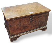 A small oak stained chest on ogee bracket feet, wi