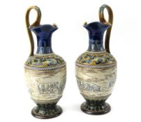 A pair of Doulton Lambeth ewers, by Hannah Barlow