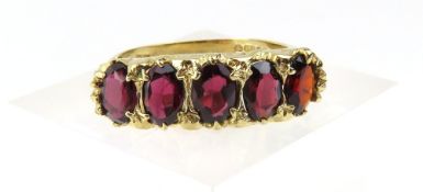 A 9ct gold five stone garnet ring, 1977, the facet