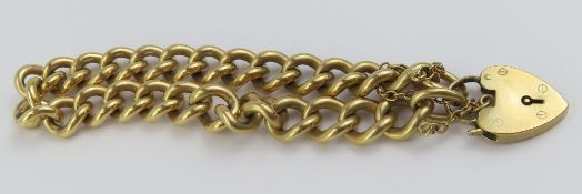 A 9ct gold curb link bracelet, with a heart shaped