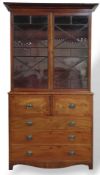 A light mahogany chest of two short and three long