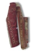 Three rugs of various sizes and designs, all with