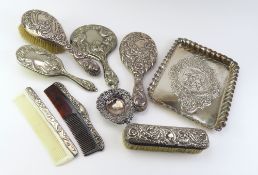 A collection of predominantly silver items, includ