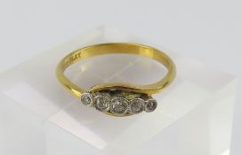 A diamond five stone twist ring, marked ‘18ct PLAT