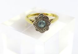 A blue zircon and diamond cluster ring, marked ‘18