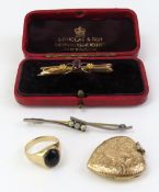 A bar brooch set with a single facetted