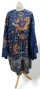 A Chinese deep blue silk kimono, profusely decorat