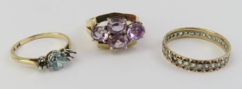 An amethyst ring marked ‘10K’, the four oval facet