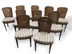 Ten oak dining chairs with curved supports decorat