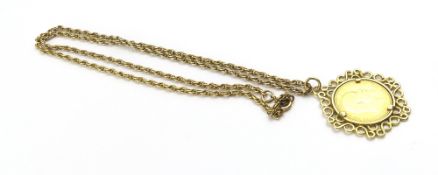 A 1903 Edward VII sovereign in a 9ct gold scroll w