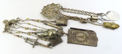 A metal chatelaine, the belt clip designed as an octopus with red eyes, with eight suspended chains,