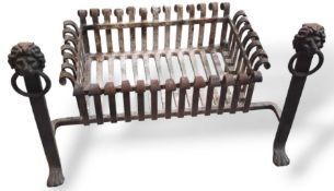 An iron fire grate with frontal feet marked at the