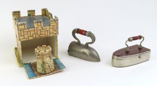 A hinged pill box in the form of an iron, set with