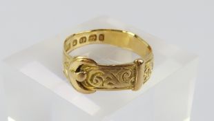 An 18ct gold buckle ring with engraved floriate de