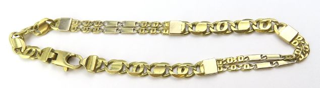 A two colour gold, filed curb and fancy link brace