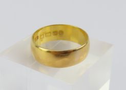 A 22ct gold wide wedding band, Samuel Hope, 1909,
