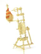A finely carved miniature bone model in the form o