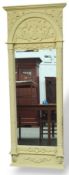 A pier style mirror with painted buff f