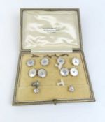 A gentleman’s mother of pearl dress set marked ‘9ct’