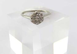 An early to mid-20th century platinum diamond cluster ring