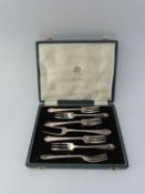 A cased set of six Mappin and Webb silver cake forks