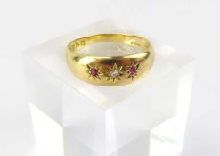An 18ct gold gypsy style three stone ring